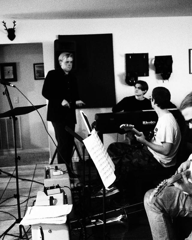 A recording session with piano, bass, and vocalist