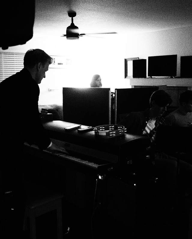 Collin at the mixing desk in his recording room